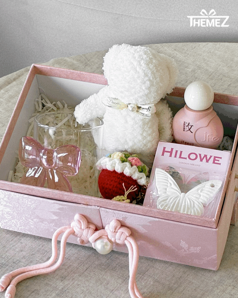 Gift box with teddy bear and accessories